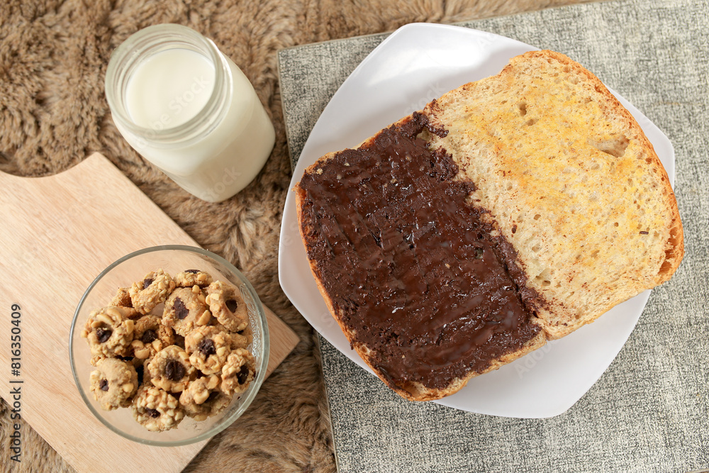 Bread with chocolate spread filling, milk and snack for breakfast Bread with chocolate spread filling, milk and snack for breakfast