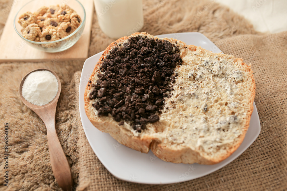 Bread with chocolate cookies oreo cheese and butter spread on a plate for breakfast
Bread with chocolate cookies oreo cheese and butter spread on a plate for breakfast