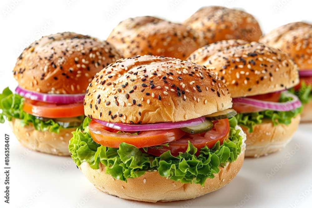 Delicious fresh veggie burgers served on sesame seed buns, layered with crisp lettuce, tomato, cucumber, and red onion. Delicious fresh veggie burgers served on sesame seed buns, layered with crisp lettuce, tomato, cucumber, and red onion.
