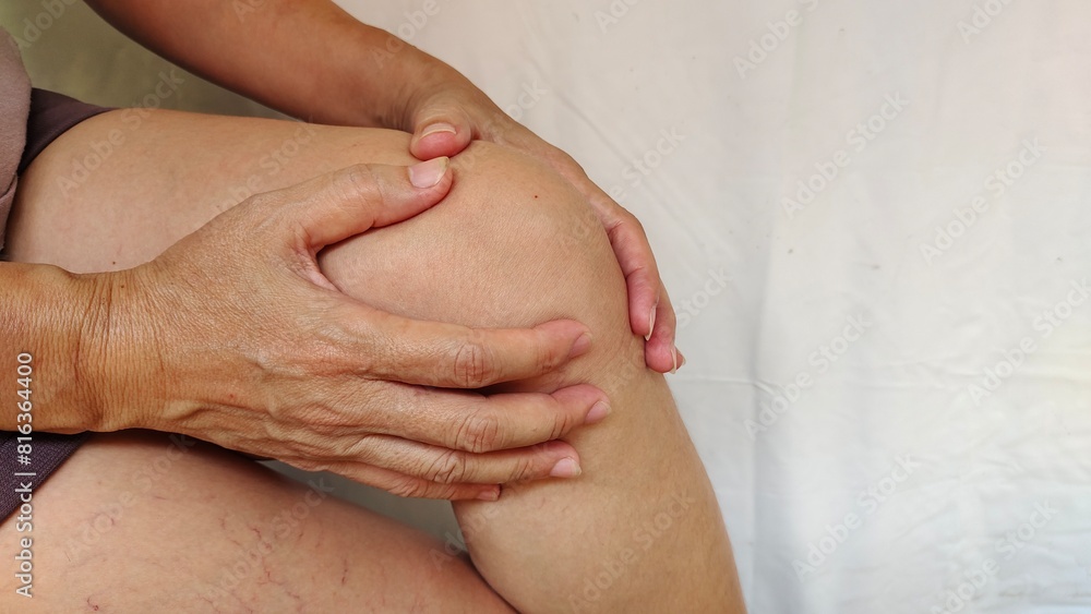 Portrait the hands holding the knee pain of the woman, health care and medical concept. Portrait the hands holding the knee pain of the woman, health care and medical concept.
