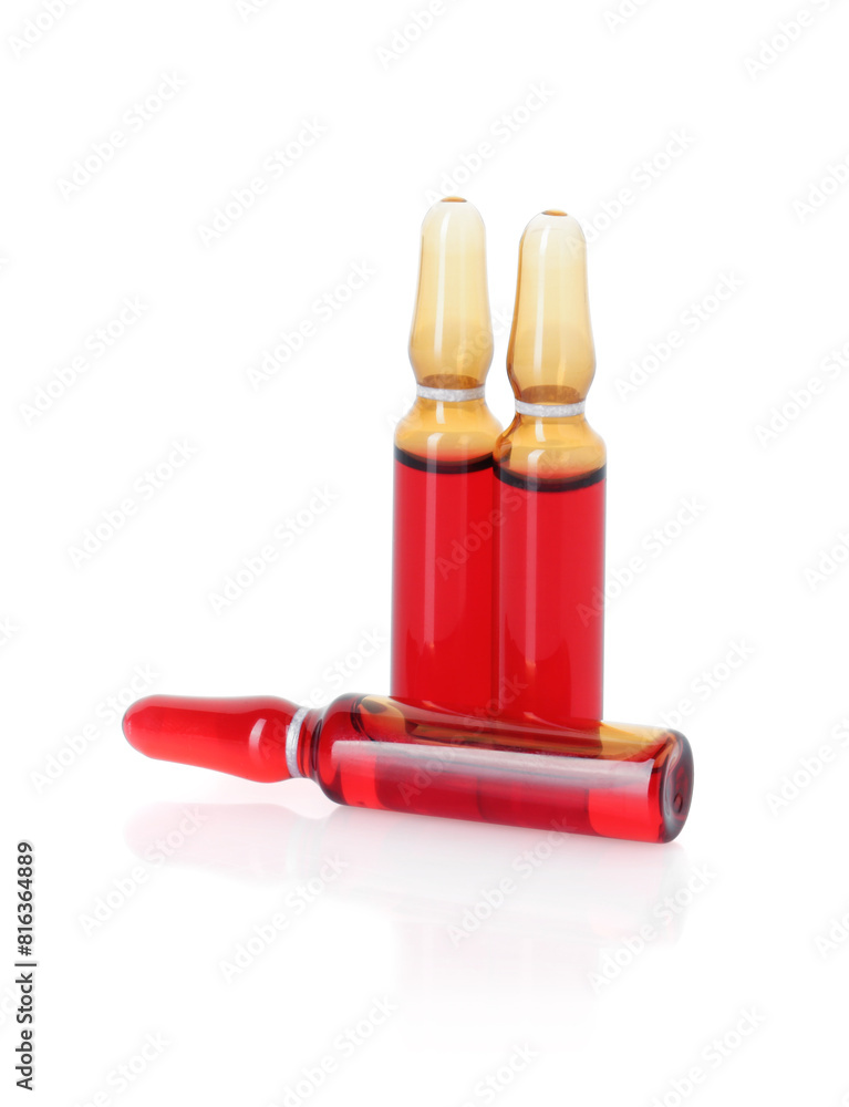 Glass ampoules with liquid isolated on white Glass ampoules with liquid isolated on white