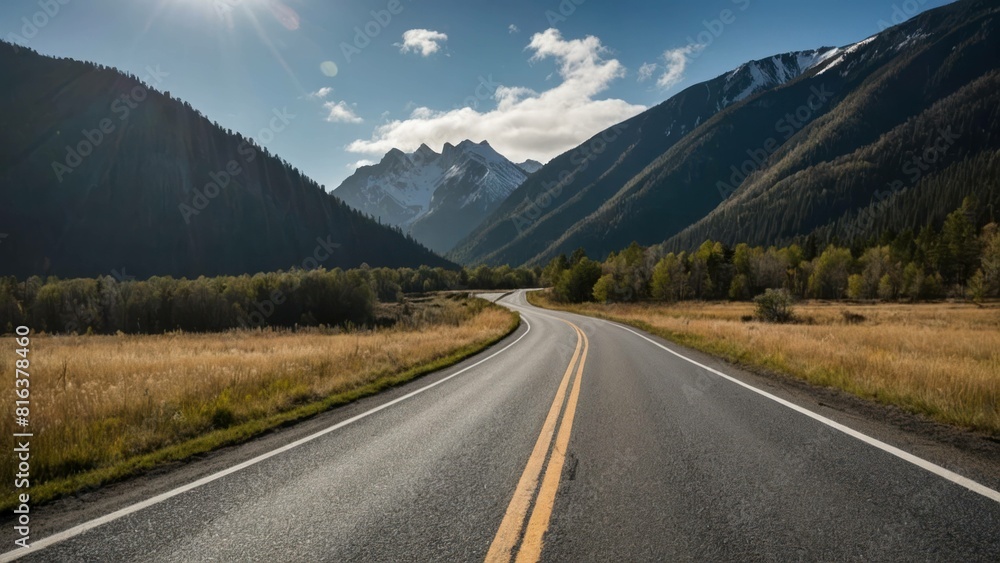 A serene road leading towards snow capped mountains at sunset A serene road leading towards snow capped mountains at sunset