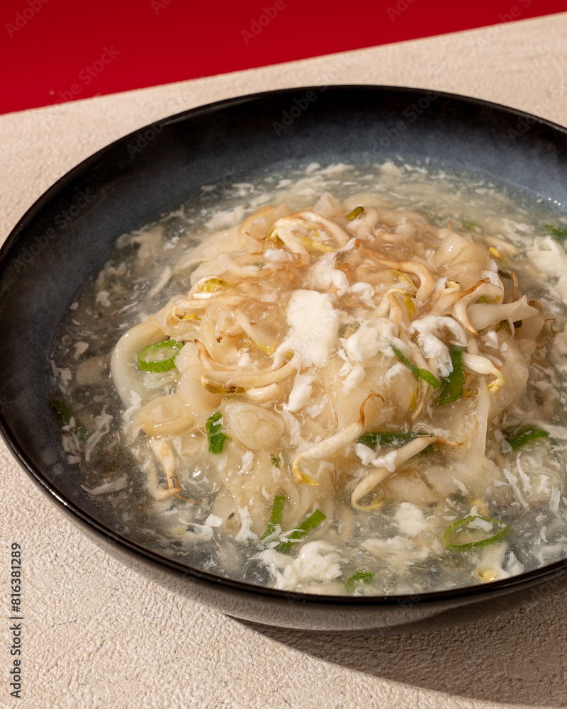 Typical Asian kwetiaw is served drizzled with spice sauce and egg Typical Asian kwetiaw is served drizzled with spice sauce and egg