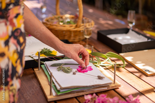 Artist pressing flowers