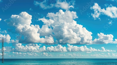 Azure ocean and sky with fluffy clouds