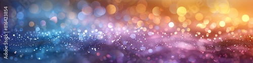 Pastel rainbow glitter bokeh mainly in pink blue and gold. 