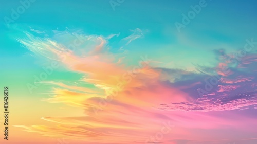 A gradient rainbow-colored sky during sunset or sunrise. 