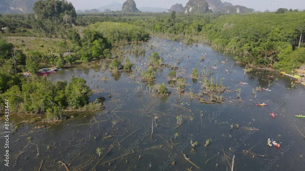 Aerial view at klong naam sai , Krabi, Thailand. Khlong Nam Sai is a small freshwater canal. The water source is caused by natural springs beneath the soil surface Aerial view at klong naam sai , Krabi, Thailand. Khlong Nam Sai is a small freshwater canal. The water source is caused by natural springs beneath the soil surface