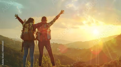 Two happy young tourists with backpacks are standing with open arms at mountain top and enjoys sunset view : Generative AI