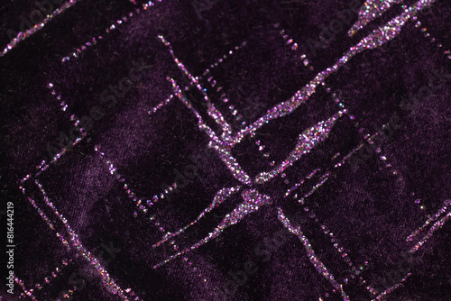 Purple glitter velvet fabric texture used as background.