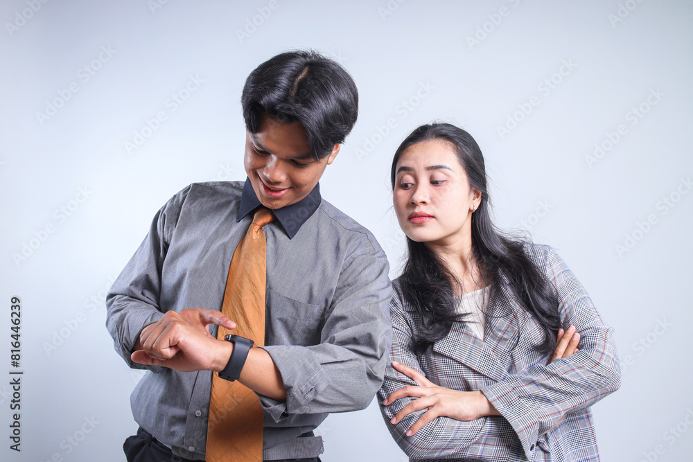 Businesswoman Looking At Watch of Her Partners Isolated On White Background. Overtime Concept. It’s Time to Go Home. Businesswoman Looking At Watch of Her Partners Isolated On White Background. Overtime Concept. It’s Time to Go Home.