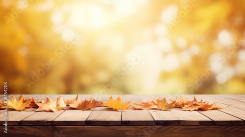 Wooden table top with autumns leaves background
