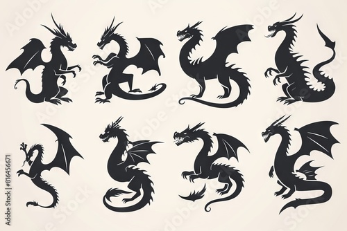 Silhouettes of dragons  depicted in various shapes and sizes  appear as black vector icons against a white backdrop. These designs embrace a straightforward style  characterized by flat colors