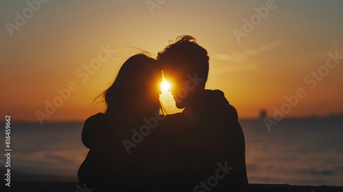 Silhouettes of a young couple in love watching the sunset together at the beach embracing each other : Generative AI