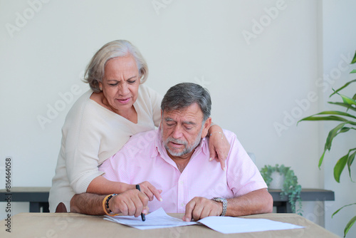 Senior couple review their investments together