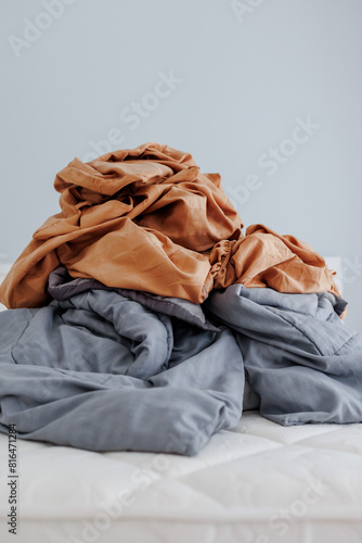 Unmade bed in modern bedroom