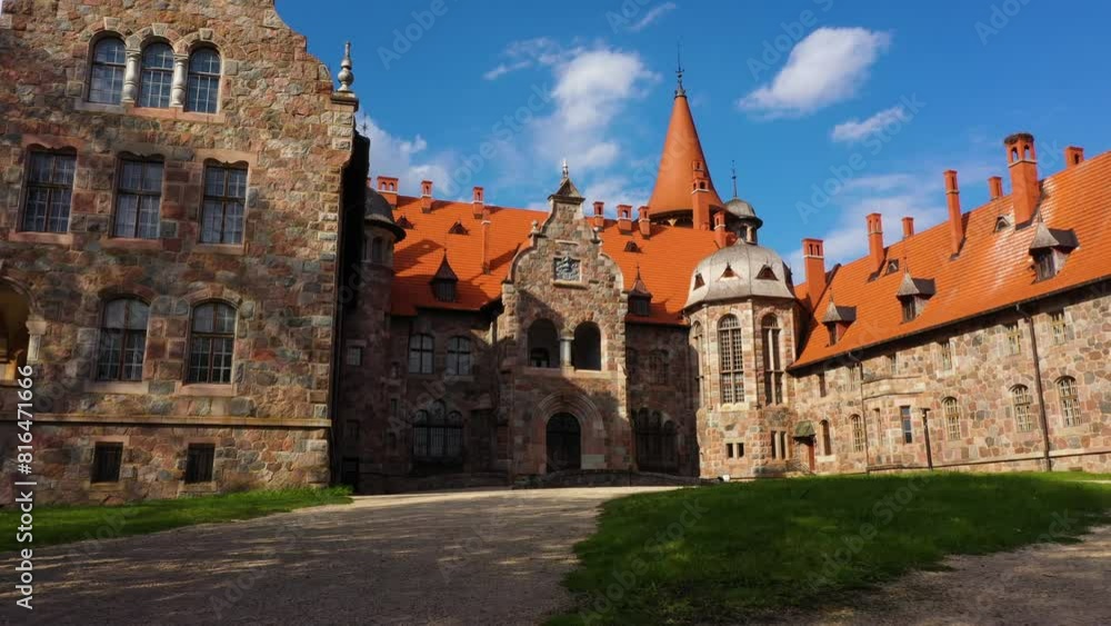 Establishing shot of Cesvaine medieval castle on a sunny summer day with blue sky above Establishing shot of Cesvaine medieval castle on a sunny summer day with blue sky above