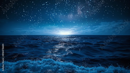Starry night sky over a calm ocean  gentle waves and a horizon glowing with starlight