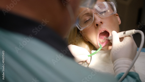 Process professional teeth cleaning in dental clinic © Евгений Логвиненко