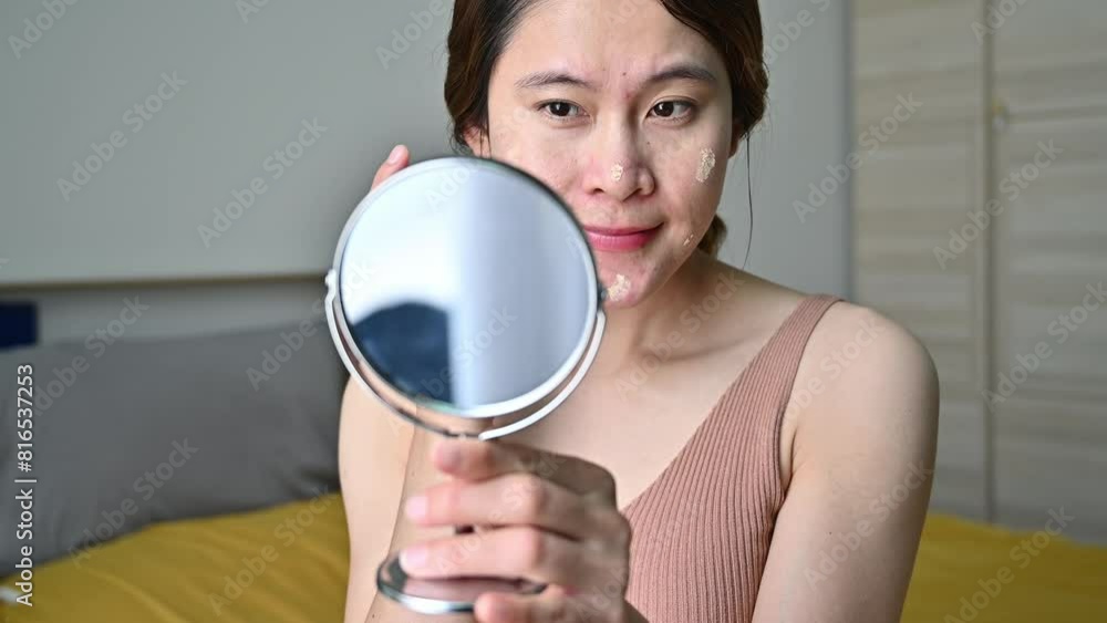 Asian woman applying cream for treat and improve her aging and acne skin. Tretinoin and adapalene are topical retinoids used to treat acne. Asian woman applying cream for treat and improve her aging and acne skin. Tretinoin and adapalene are topical retinoids used to treat acne.