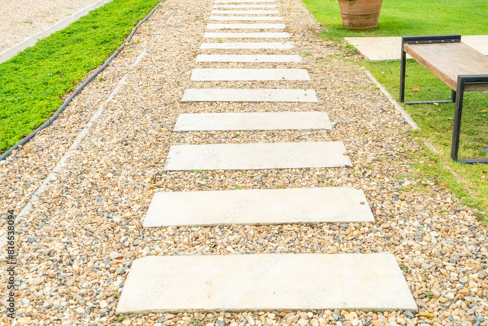 Marble walkway of square tiles in backyard of the mansion,Alley in tropical garden,Garden landscape design with pathway,Selective focus. Marble walkway of square tiles in backyard of the mansion,Alley in tropical garden,Garden landscape design with pathway,Selective focus.