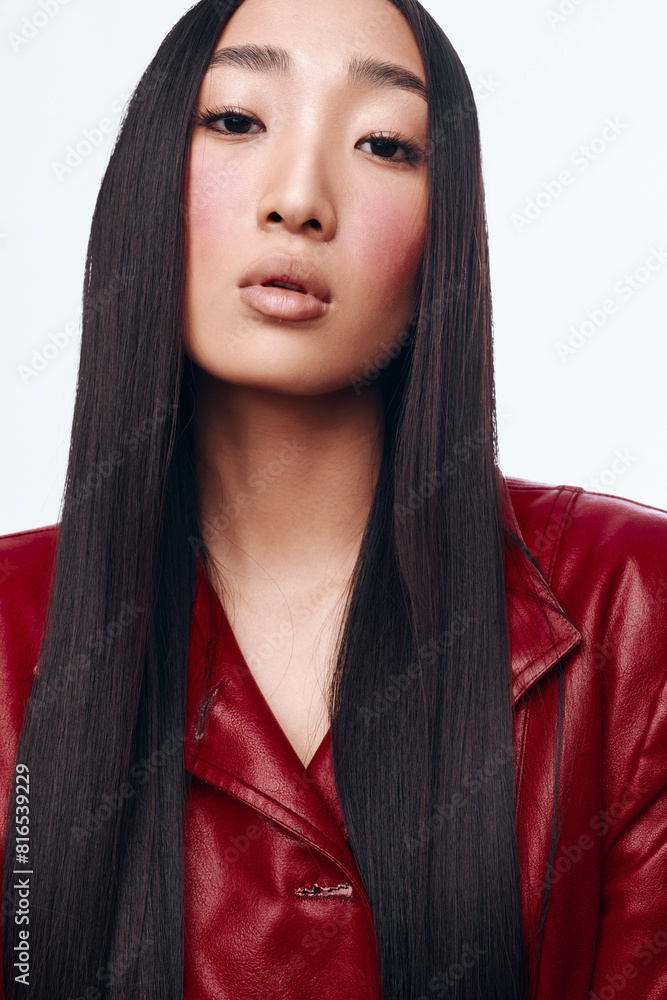 Stylish Asian Woman with Long Black Hair in Red Leather Jacket Posing for Camera Stylish Asian Woman with Long Black Hair in Red Leather Jacket Posing for Camera