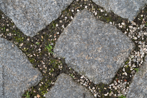 square shaped paving stone on the ground