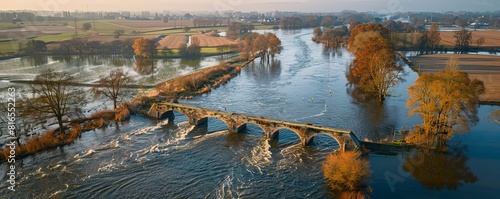 Aerial view of high water of flooded floodplains of river Vecht with bridge and weir, Junne, Vechtdal, Overijssel, Netherlands. photo