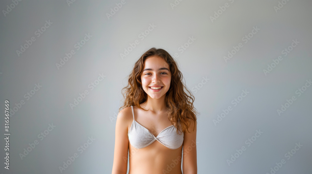 Obraz premium Headshot of Teen Girl in Light Grey Swimwear