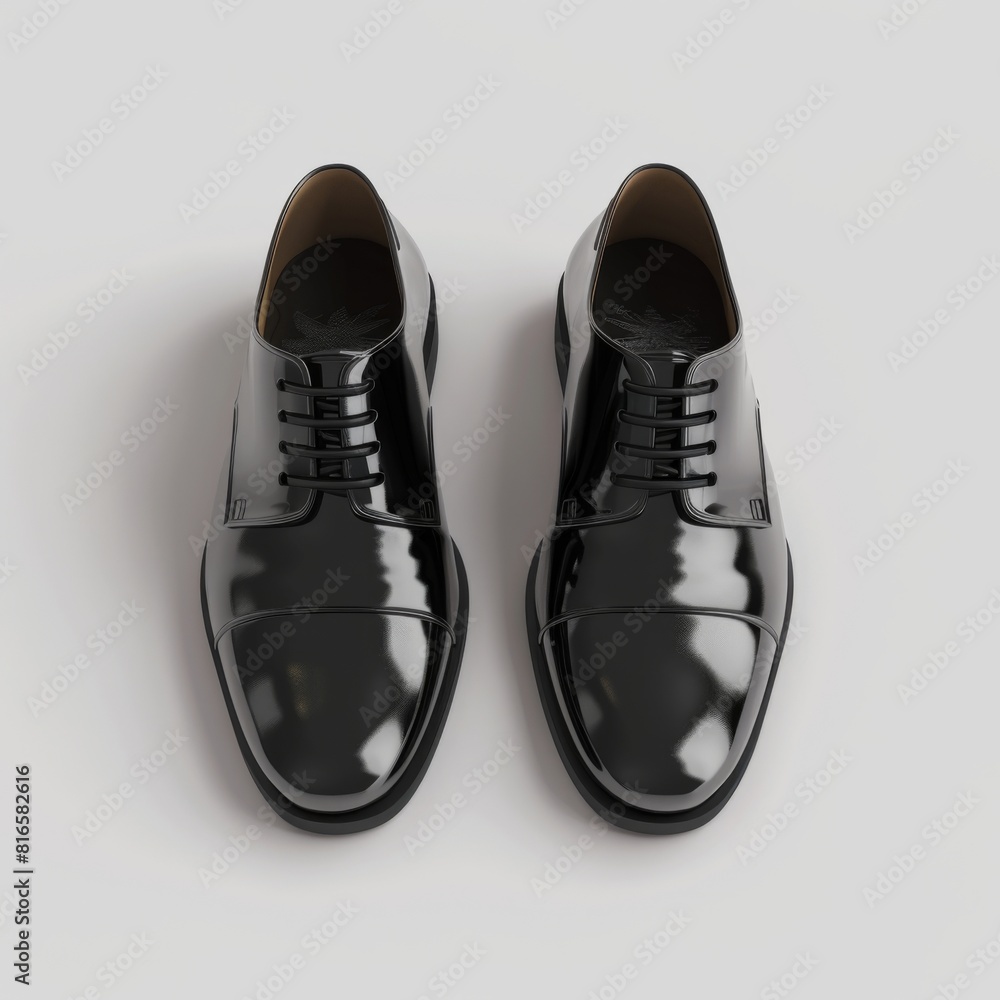 Pair of black oxford shoes placed on a clean white surface Pair of black oxford shoes placed on a clean white surface