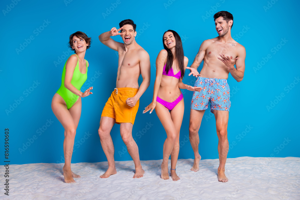 © deagreez - Photo of positive best friends ladies guys dance enjoy relax on exotic island isolated blue color background