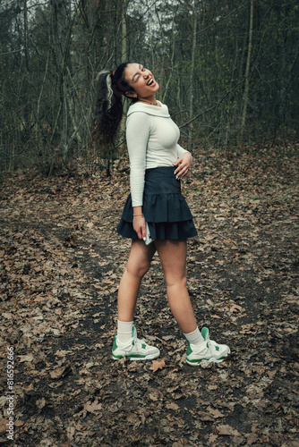 Teenage girl posing in spring forest