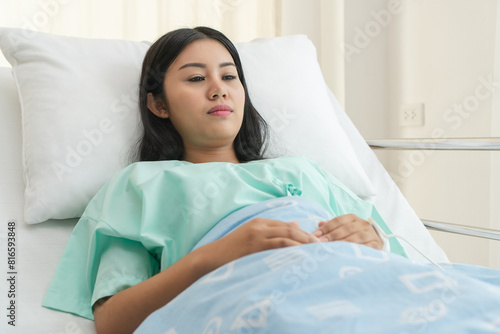 female patient lying on the bed in hospital