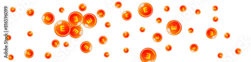 Vitamin E round capsules scattered randomly.