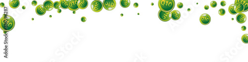 Vitamin Q10 round capsules scattered randomly.