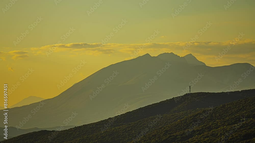 Clouds Passing Over Mountain Peaks At Misty Sunrise. Timelapse Clouds Passing Over Mountain Peaks At Misty Sunrise. Timelapse