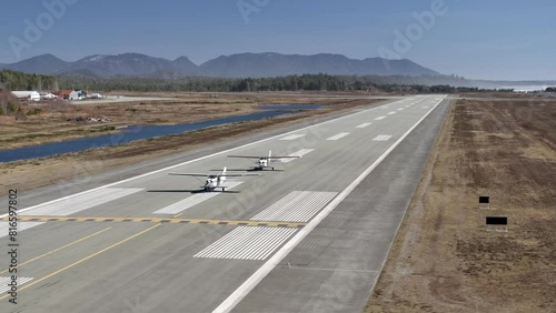 Aerial View of Two Propeller Airplanes on the Runway - Sunny Day photo