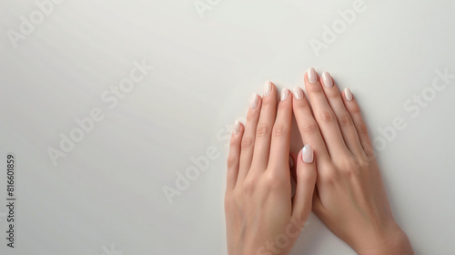 Hands of young woman with beautiful manicure on white