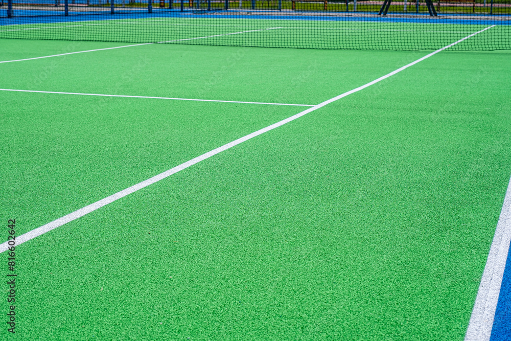 Fototapeta premium Part of the synthetic grass tennis court with markup