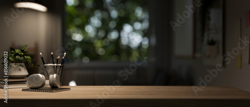 A copy space for displaying products on a wooden tabletop in a dark living room.