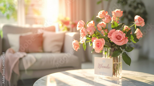 Interior of living room with roses in vase and card 