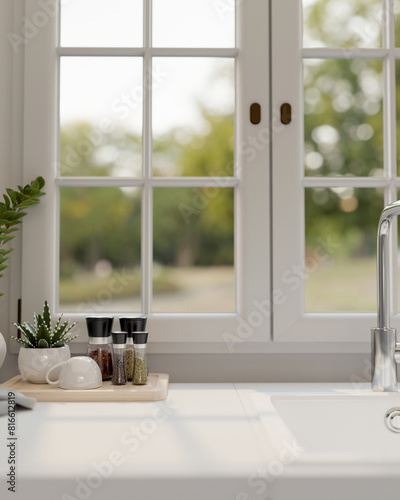 A close-up shot of a white and clean kitchen countertop against the window.