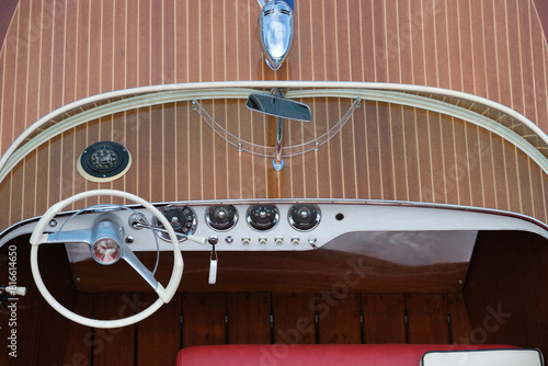 Control panel of the speed-boat luxury wooden boat top view. Varnished wooden boat