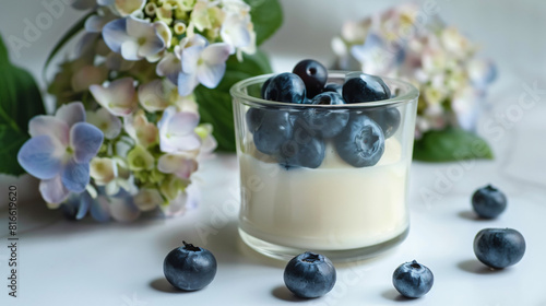 Glass jar of panna cotta with blueberry