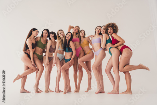 No filter photo of group community ten girls hugs in public bath wear bikini isolated on white color background