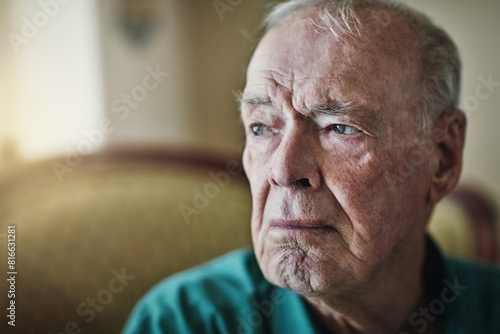Elderly  man and sad with thinking of grief in retirement home with remember  nostalgia and memory on sofa. Senior  person and lonely with alzheimers  depression and thoughtful on couch with mockup