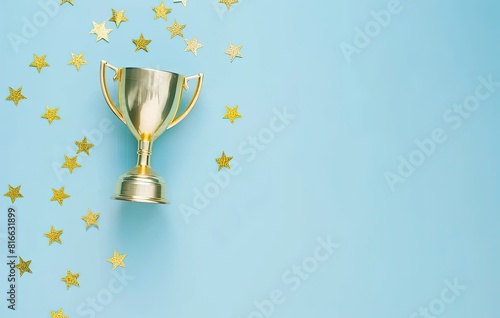 A golden trophy on a teal background, surrounded by sparkling stars. Symbolizes achievement, victory, and excellence. A perfect image for celebrating success, honoring winners, or motivating performe photo