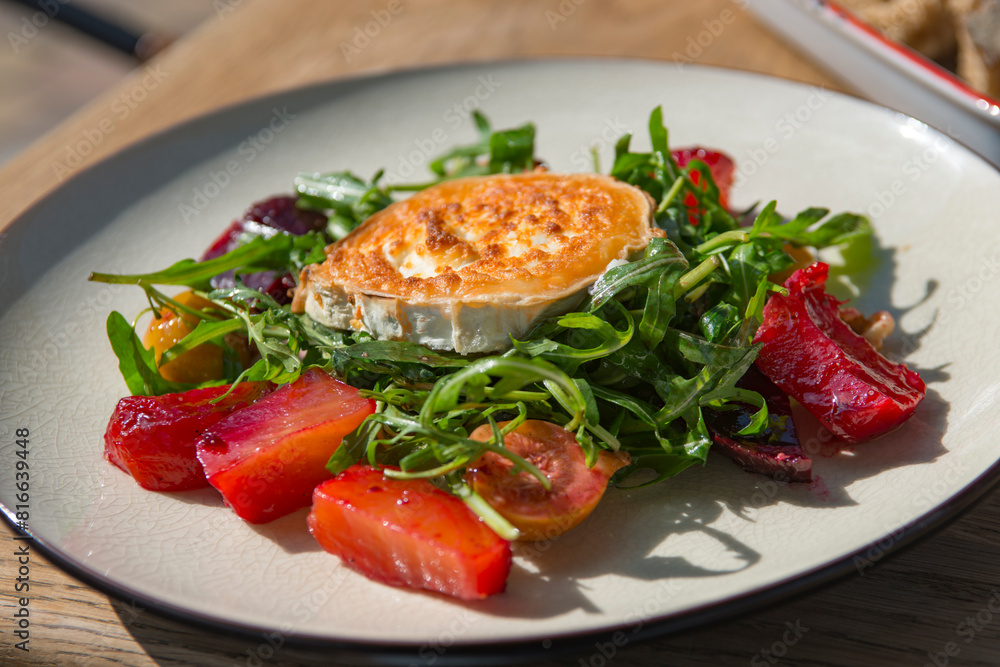 Fried goat cheese , cherry tomatoes and arugula . Fried goat cheese , cherry tomatoes and arugula .