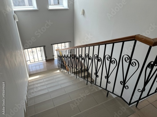 фотографія Long ceramic staircase with vintage handrails