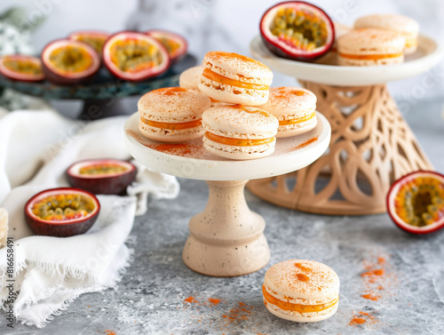 The macarons, arranged with care on a cake stand, display the vibrant sandwich cookies that are iconic in French gastronomy. In the backdrop, passion fruit adds a tropical touch.